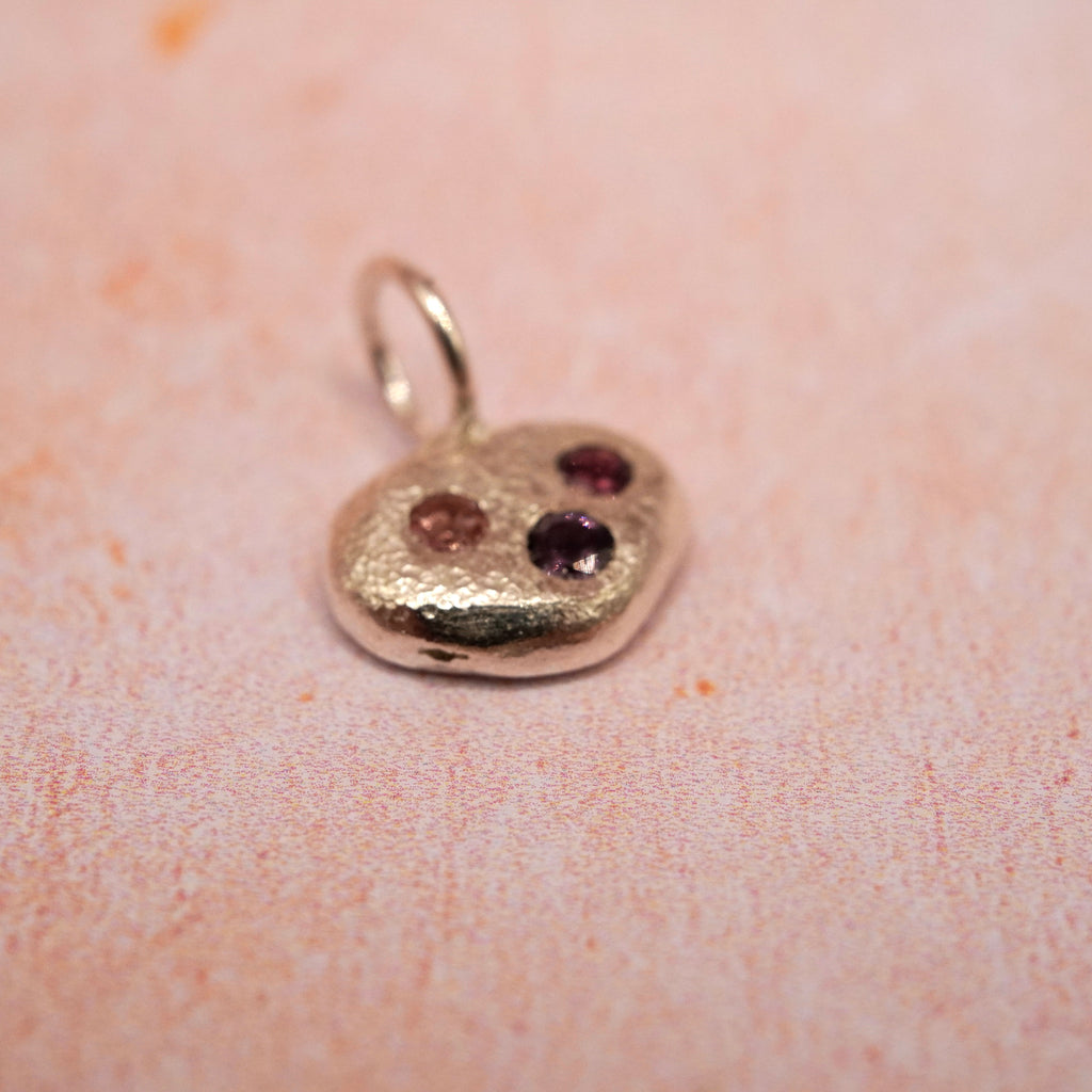 Pebble and Stone Silver Pendant with Garnet
